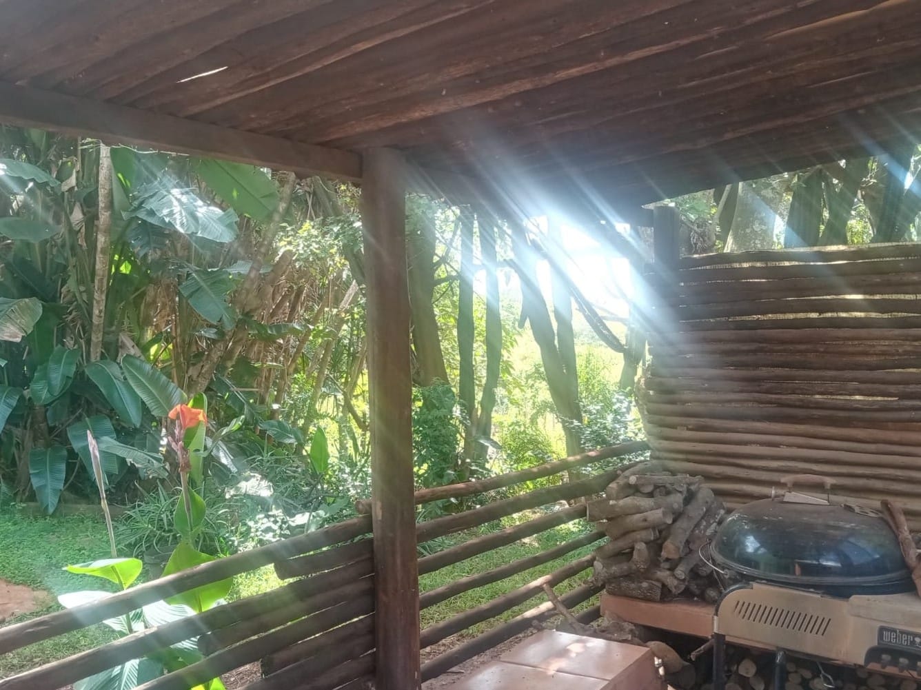 Firewood and braai stand at Ethlathini Rest Camp campsite stoep, Hluhluwe KZN